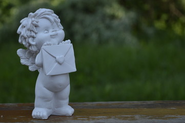 Naked angel with letter in hand, angel with envelope, postman angel, white angel, chubby angel,...