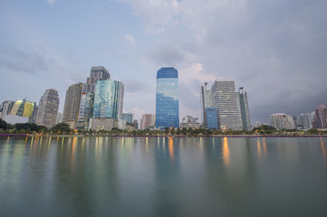 Fototapeta na wymiar bangkok City view in public park with water reflection during twilight