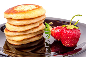 fritters on a plate with strawberries isolated white background