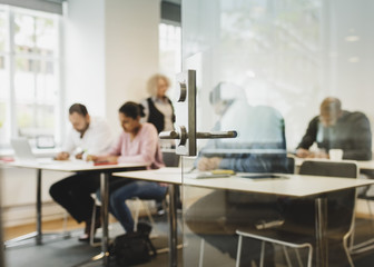 Teacher and students in language class seen through open door