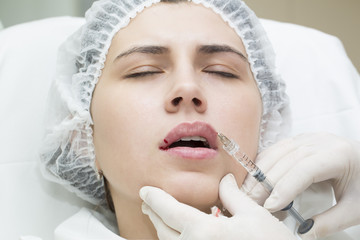 young girl in a clinic contour lips procedure