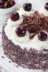 Black forest cake ,decorated with whipped cream and cherries Schwarzwald pie, dark chocolate