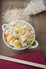 Rice with vegetables on white background