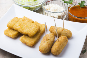 croquettes balls and different kind of sauces on a plate on a cl