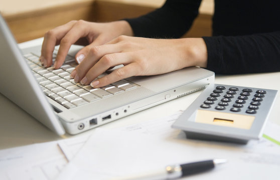Woman writing on her computer