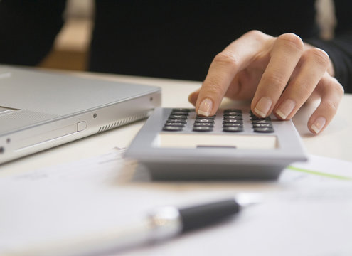 Woman using a calculator