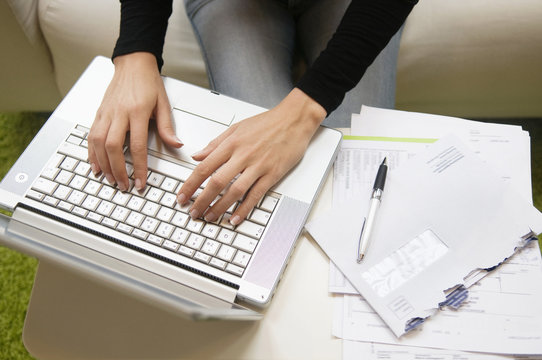 Woman writing on a keyboard