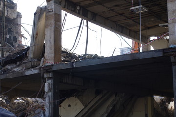 Fototapeta na wymiar Incomplete demolition of a concrete building