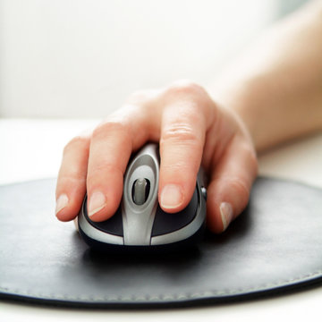 Hand using computer mouse