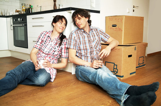 Couple taking a brake while moving
