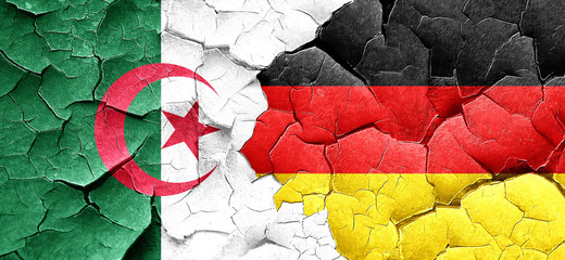 algeria flag with Germany flag on a grunge cracked wall