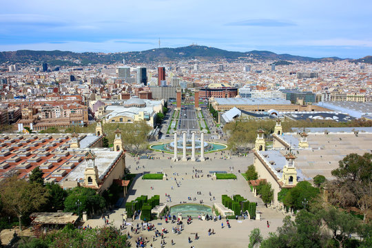 Aerial view on the magic fountain and Placa d'Espanya in Barcelona from top terrace of the National Art Museum of Catalonia in Montjuic hill. Citytrip destination on summer sunny day.