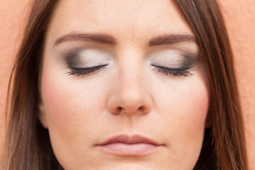 Close up of woman face with make up.