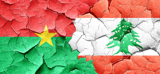 Burkina Faso flag with Lebanon flag on a grunge cracked wall