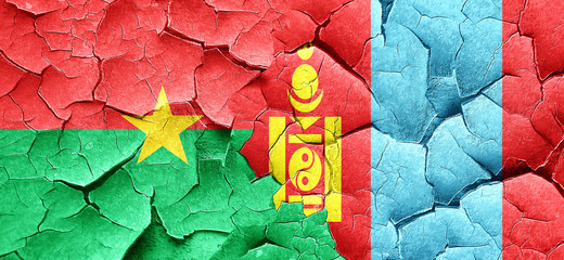 Burkina Faso flag with Mongolia flag on a grunge cracked wall