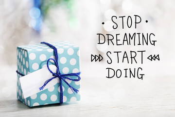 Stop Dreaming Start Doing message with gift box
