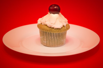 Sweet cupcake with cherry