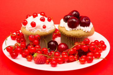 Sweet cupcakes with berries and cherries
