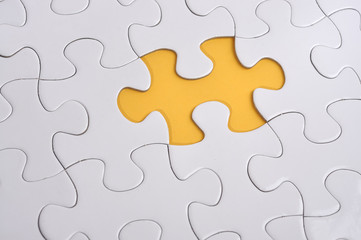 Fototapeta premium Missing Puzzle on Yellow Background, Searching a Solution 