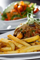 chicken fried rice with fries and a salad