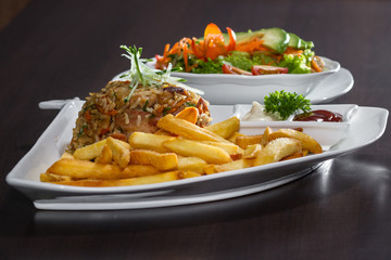 chicken fried rice with fries and a salad