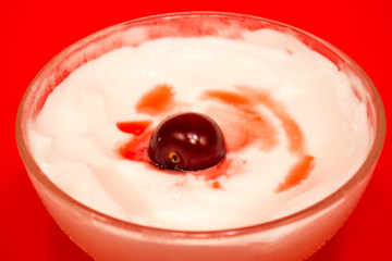 Cherry dessert in a glass cup