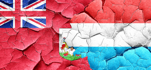 bermuda flag with Luxembourg flag on a grunge cracked wall