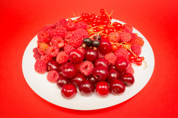 Red fruit in white plate