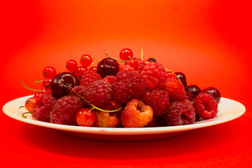Red fruit in white plate