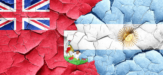 bermuda flag with Argentine flag on a grunge cracked wall