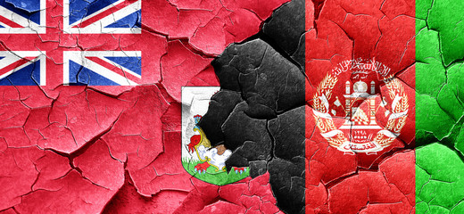 bermuda flag with afghanistan flag on a grunge cracked wall