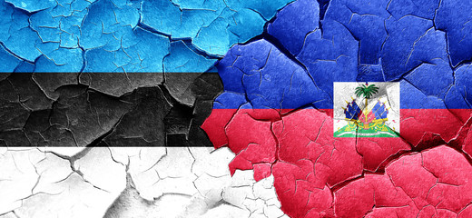 estonia flag with Haiti flag on a grunge cracked wall