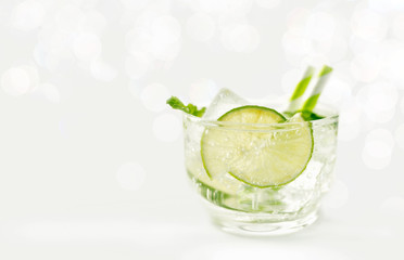 Bright lime mint soda on bokeh background