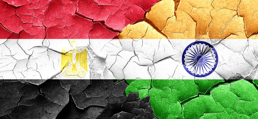 Egypt flag with India flag on a grunge cracked wall
