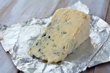 Blue cheese on open tin fuil