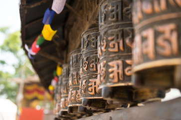 closed up the prayer wheel at temple in Kathmandu, Nepal - Powered by Adobe