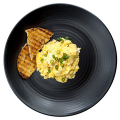 Scrambled Eggs with Toast on Black Plate Isolated