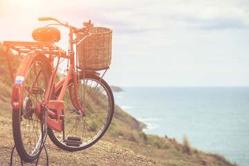 Red Japan style classic bicycle at ocean view point