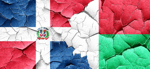 dominican republic flag with Madagascar flag on a grunge cracked