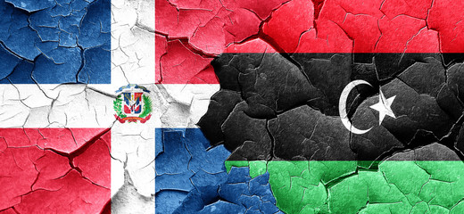 dominican republic flag with Libya flag on a grunge cracked wall