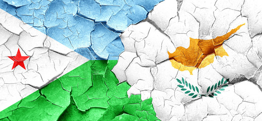 Djibouti flag with Cyprus flag on a grunge cracked wall