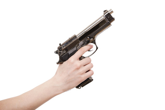 Hand holding gun isolated on white background