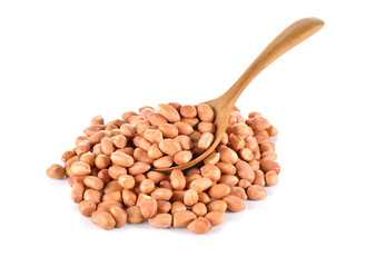 uncooked dry peanut on wooden spoon and white background