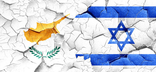 Cyprus flag with Israel flag on a grunge cracked wall