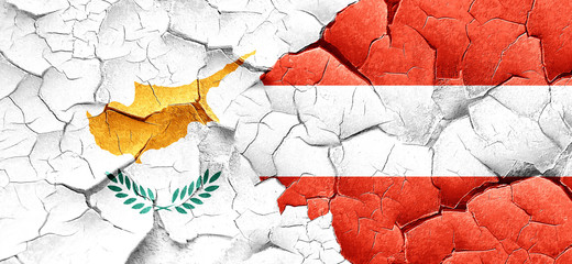Cyprus flag with Austria flag on a grunge cracked wall