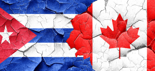 Cuba flag with Canada flag on a grunge cracked wall