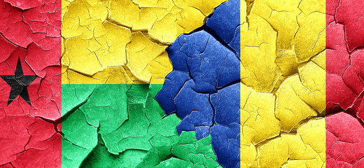 Guinea bissau flag with Romania flag on a grunge cracked wall