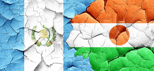 guatemala flag with Niger flag on a grunge cracked wall