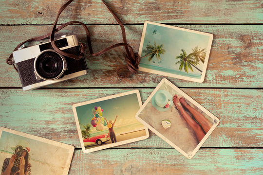 Summer photo album of journey honeymoon trip on wood table. instant photo of vintage camera - vintage and retro style