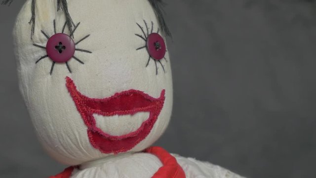 Hand made jester puppet scary cotton doll slow panning 4K 2160p 30fps UltraHD footage - Scary buffon eyes and smile doll 4K 3840X2160 UHD video